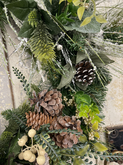 Large square winter pine with snowy branches and berries with winter nests
