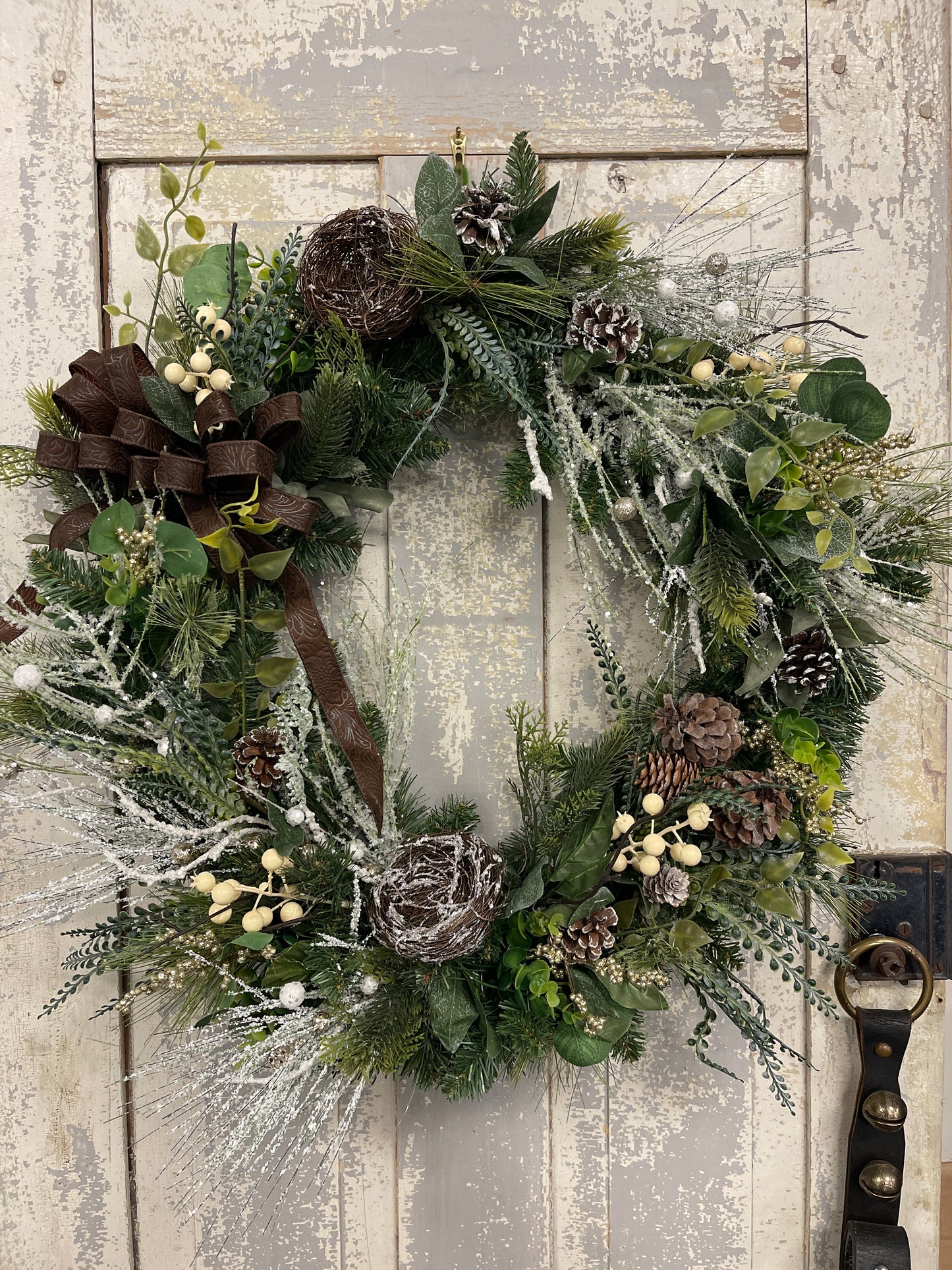 Large square winter pine with snowy branches and berries with winter nests