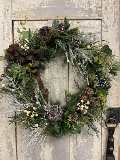 Large square winter pine with snowy branches and berries with winter nests