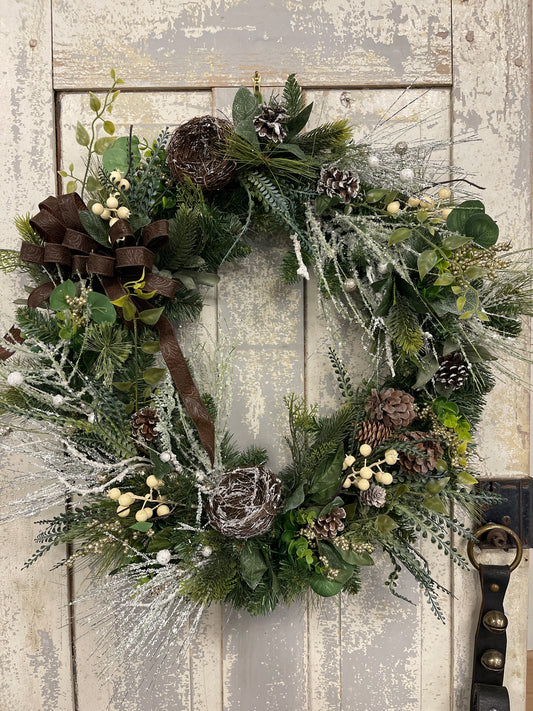 Large square winter pine with snowy branches and berries with winter nests