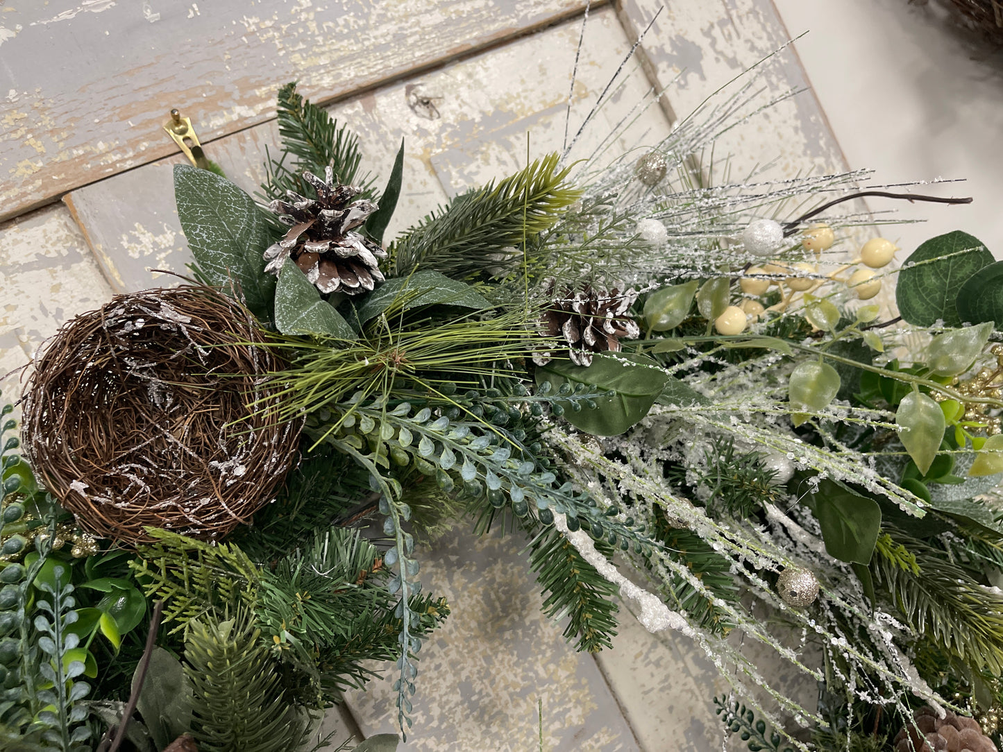 Large square winter pine with snowy branches and berries with winter nests