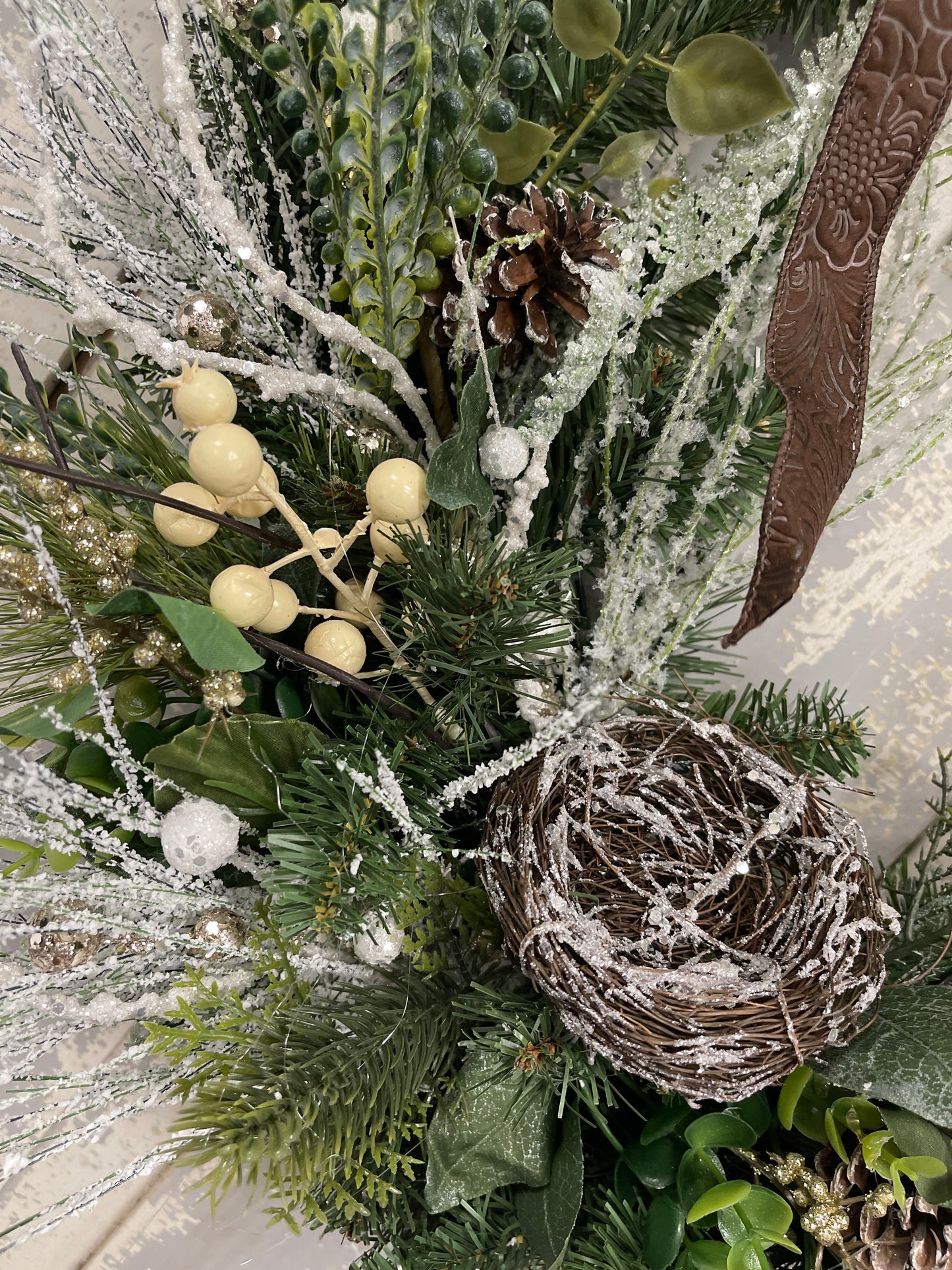 Large square winter pine with snowy branches and berries with winter nests