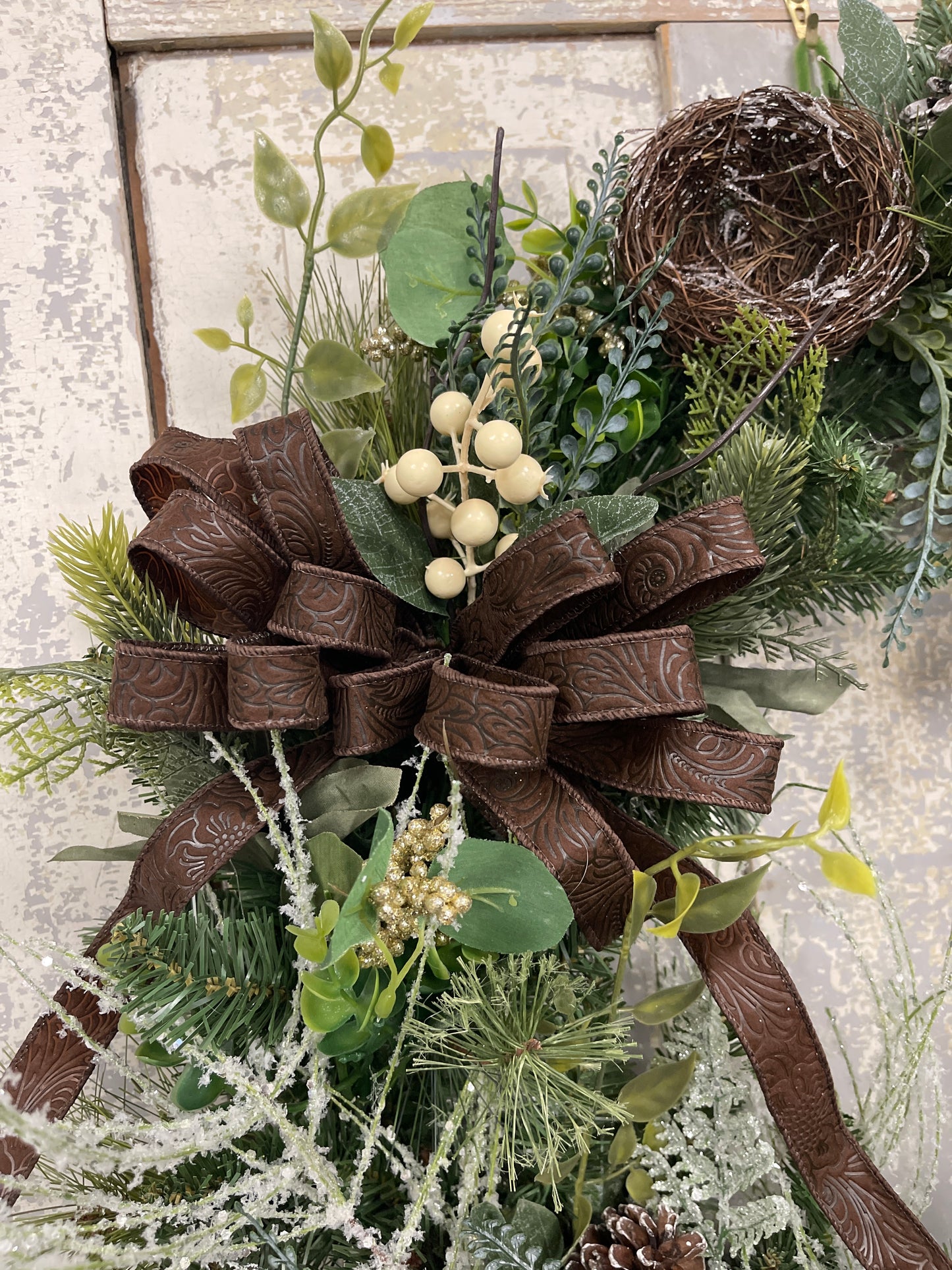Large square winter pine with snowy branches and berries with winter nests