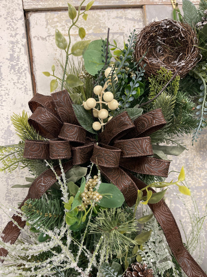 Large square winter pine with snowy branches and berries with winter nests